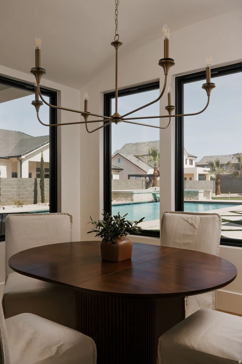 Dining area featuring hanging lights and lofted ceiling