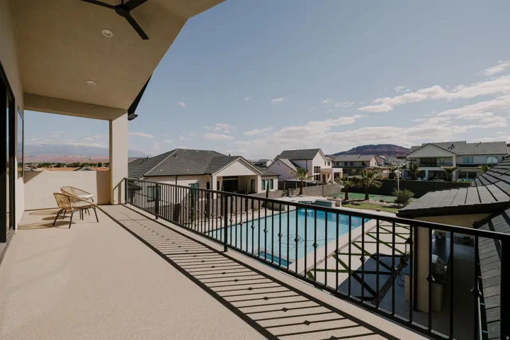 Balcony featuring a residential view and view of pool