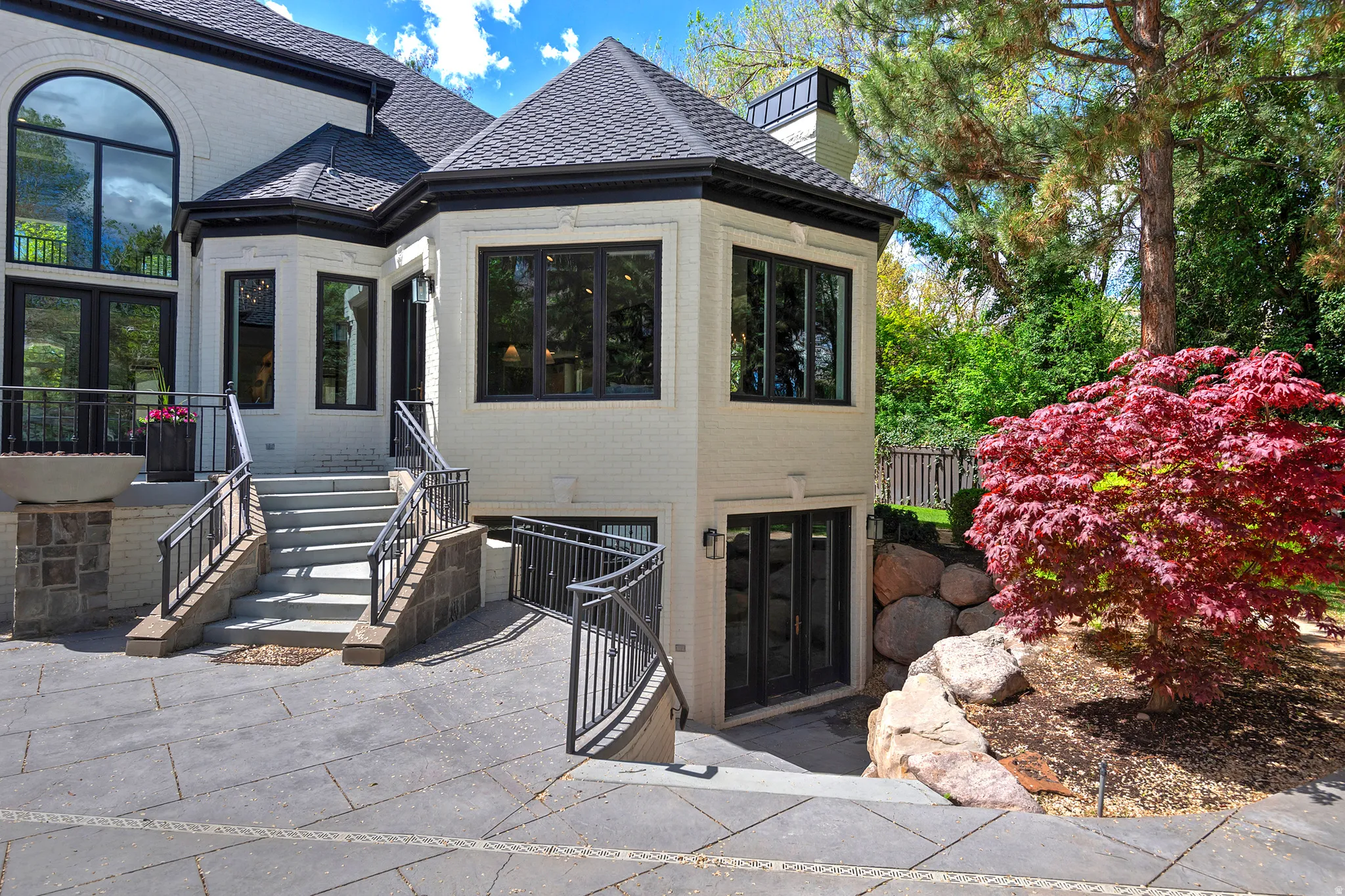 Property walkout lower level entrance with French doors