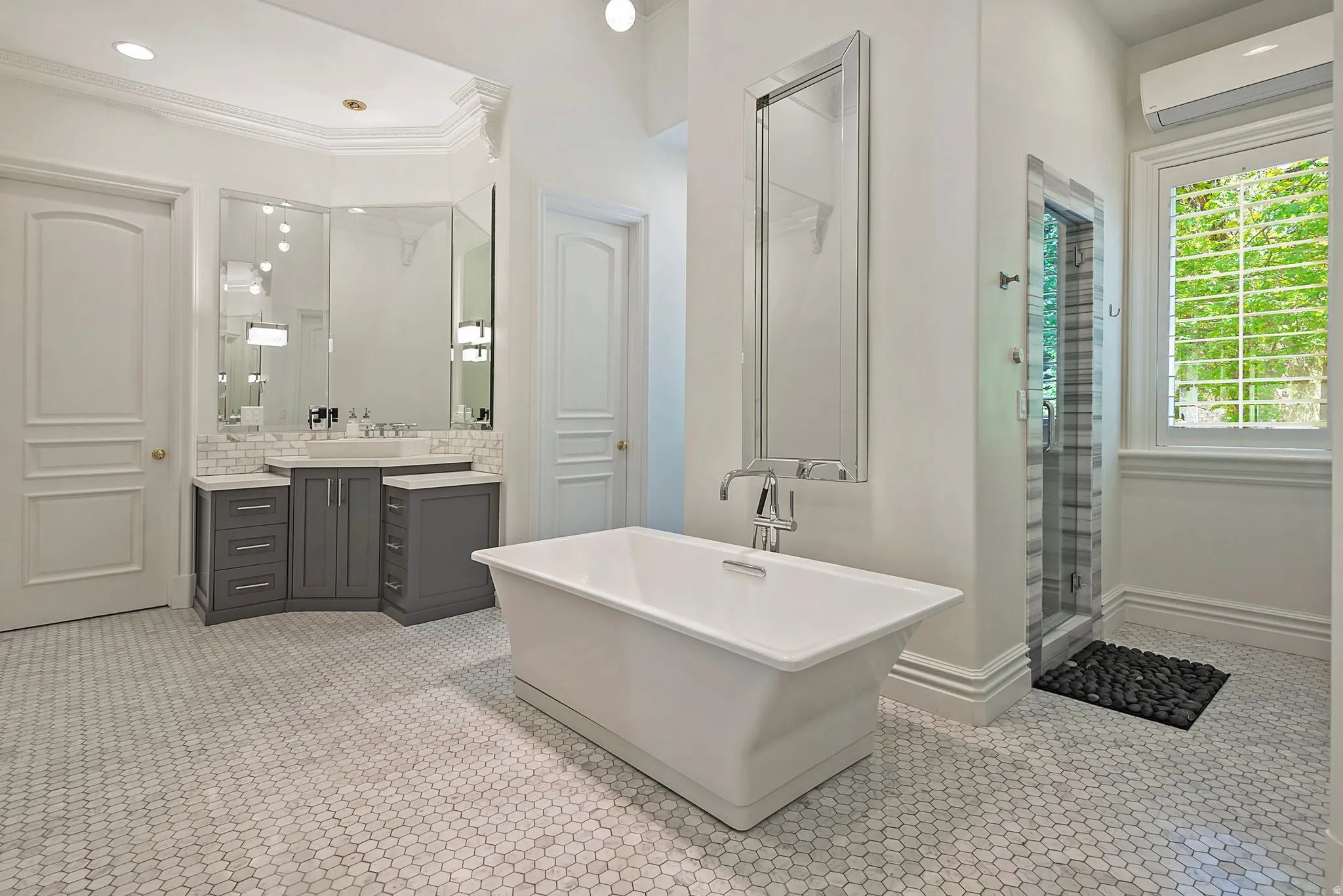 Primary ensuite bath with dual vanities, huge closets, water closets, soaker tub