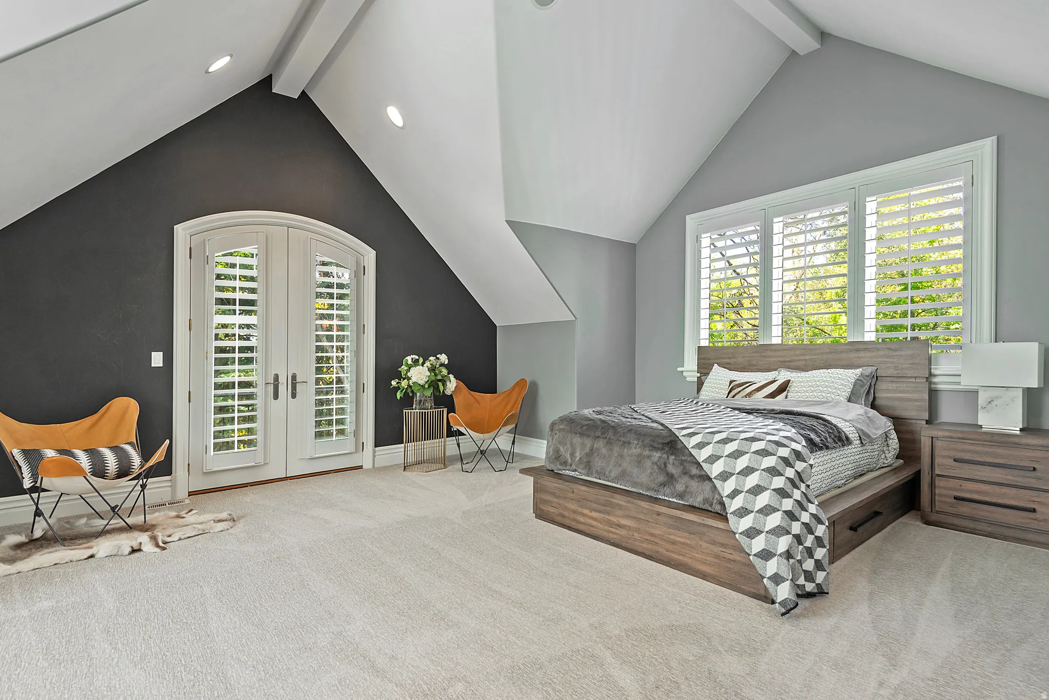 Guest suite offers en suite bathroom, vaulted beamed ceiling and privacy.french doors with charming Juliet balcony