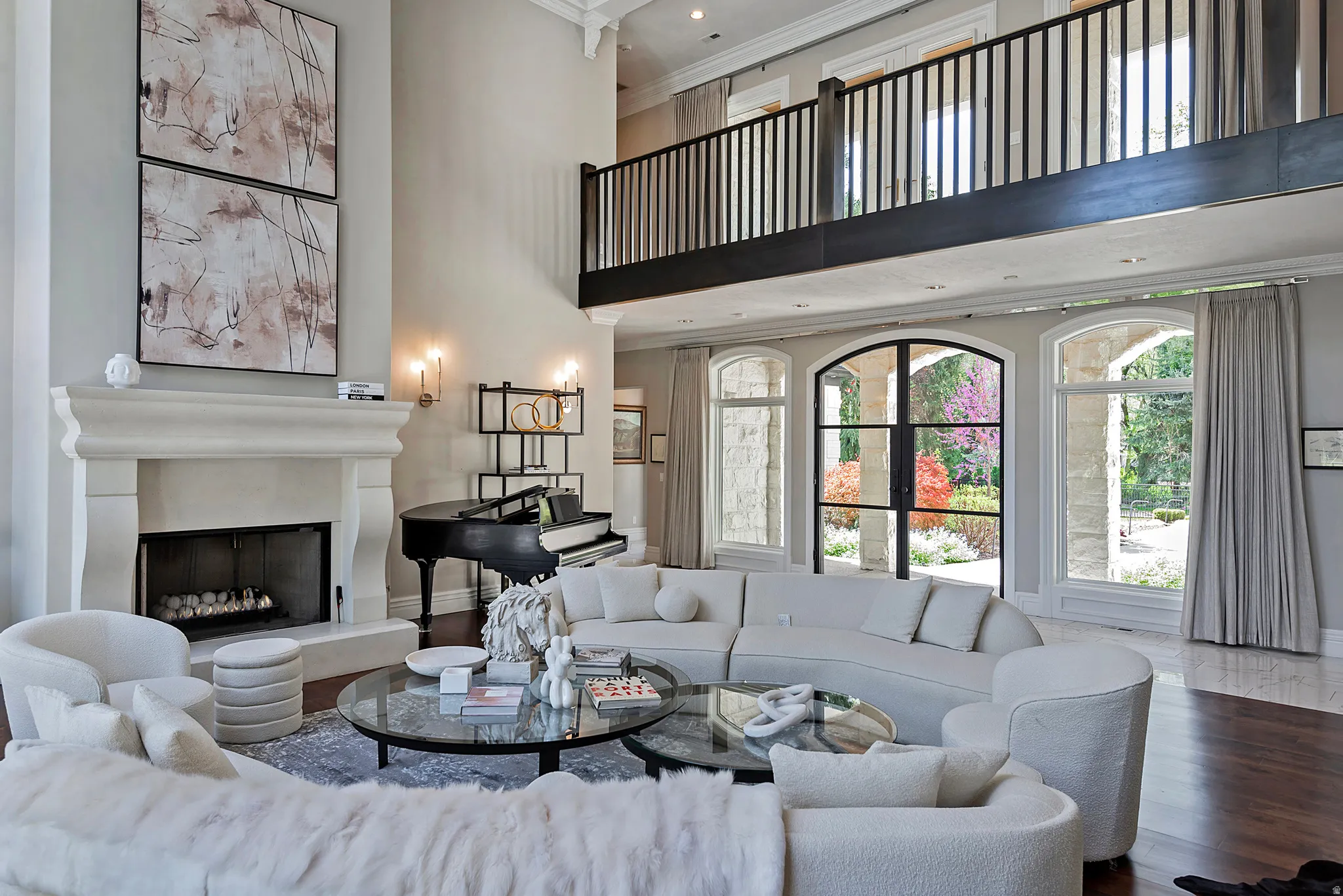 Living area featuring with overlook catwalk, reading nooks, and surrounded by stunning windows for so much natural light