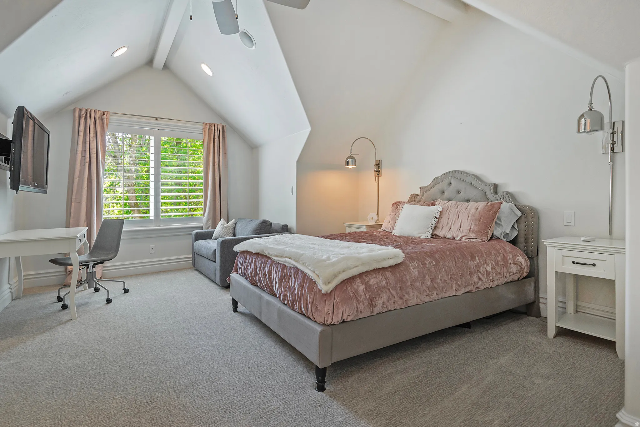 Guest suite offers walk in closet, en suite bathroom, vaulted ceiling and privacy.