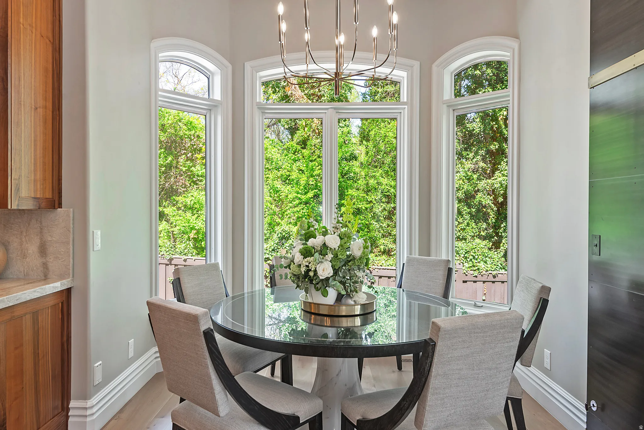 Dining nook featuring suspended lighting with tons of natural light