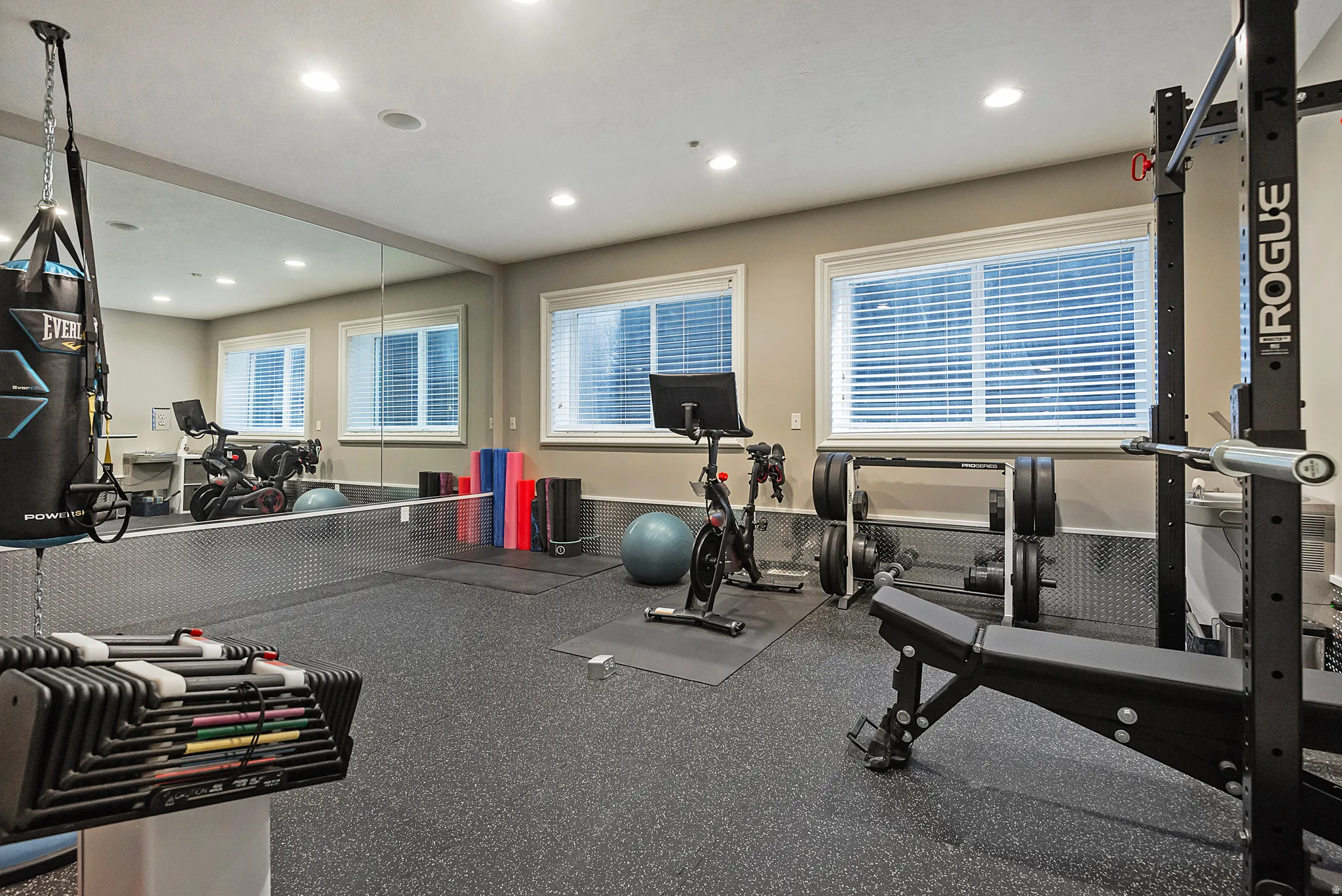 Gym with proper flooring and recessed lighting