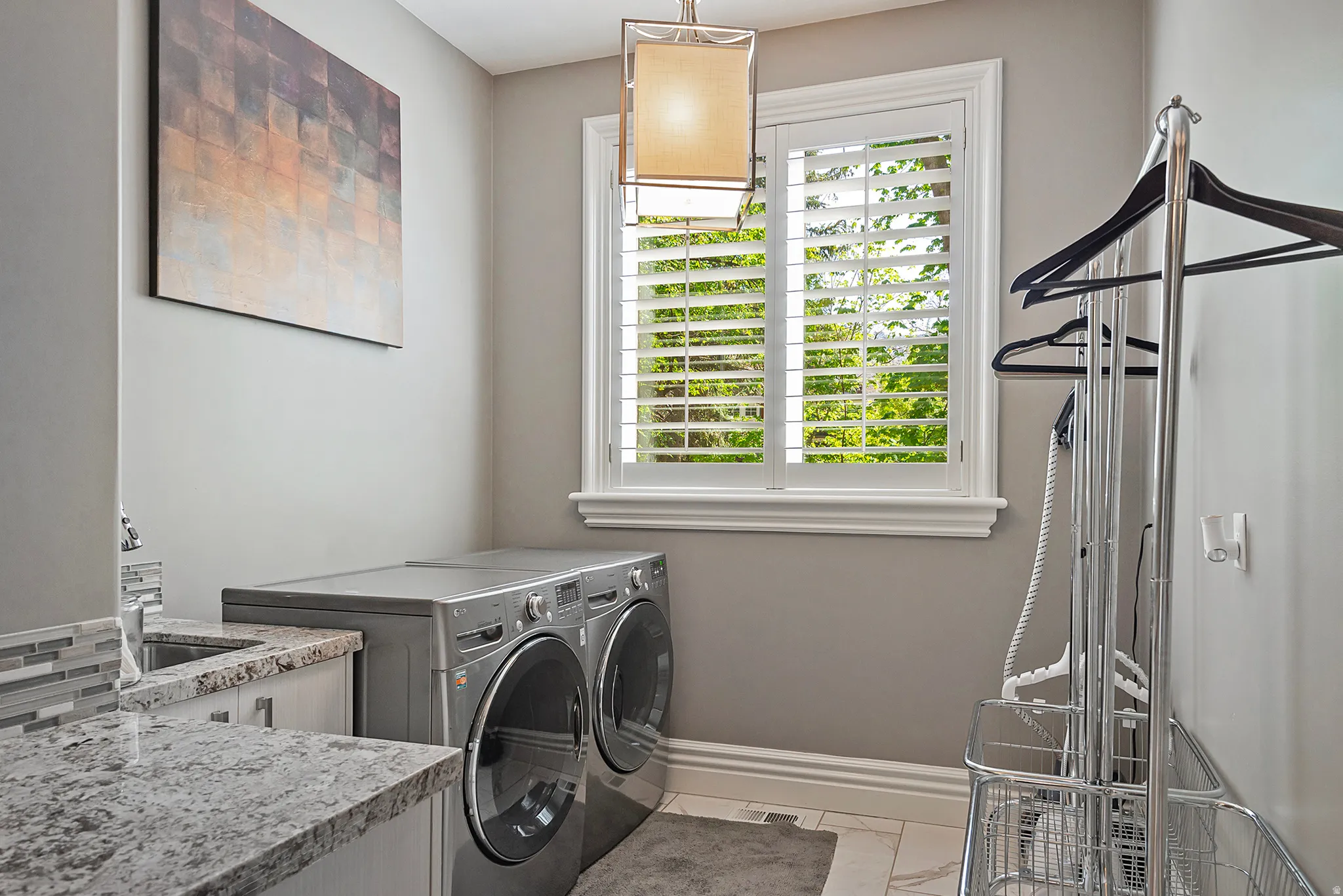 Main floor Laundry room with sink and built ins