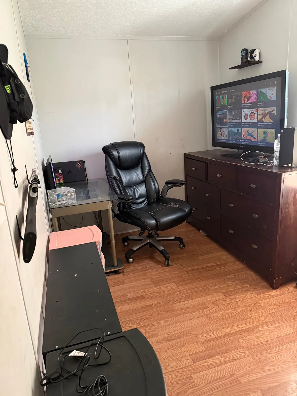 Office space with light wood finished floors and a textured ceiling