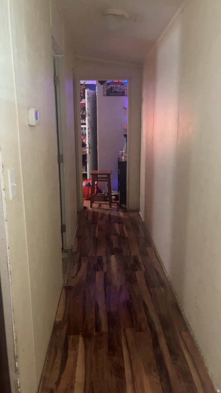 Corridor with dark wood-style floors