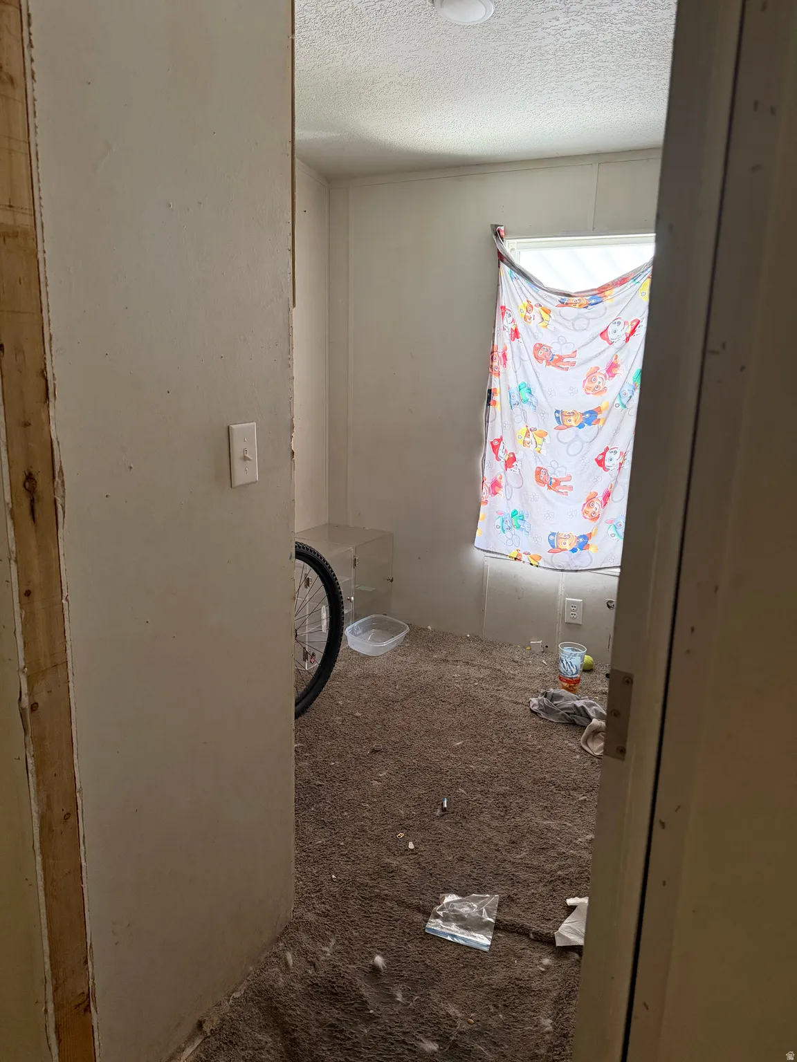 Bathroom featuring a textured ceiling