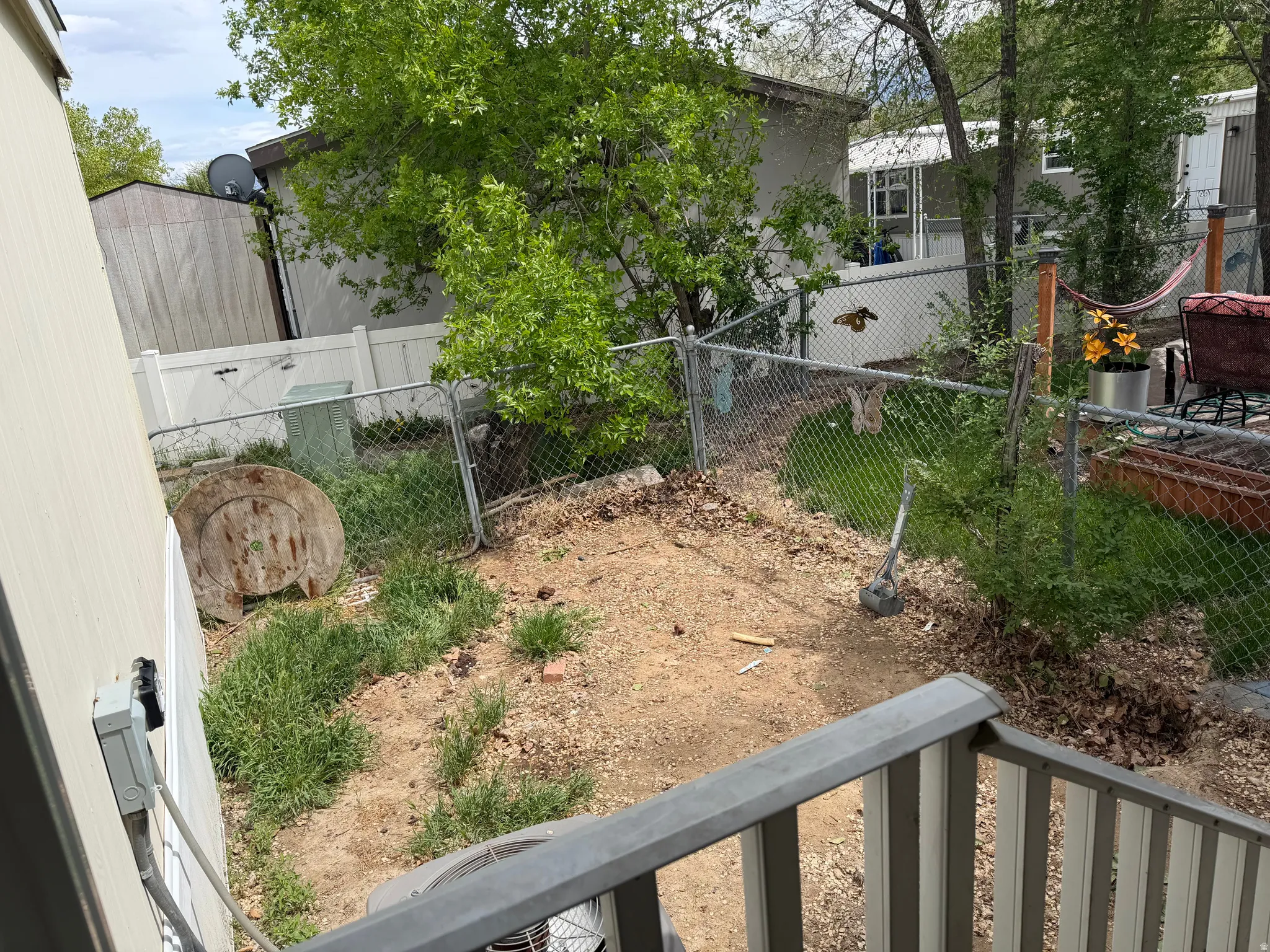 View of yard with a balcony
