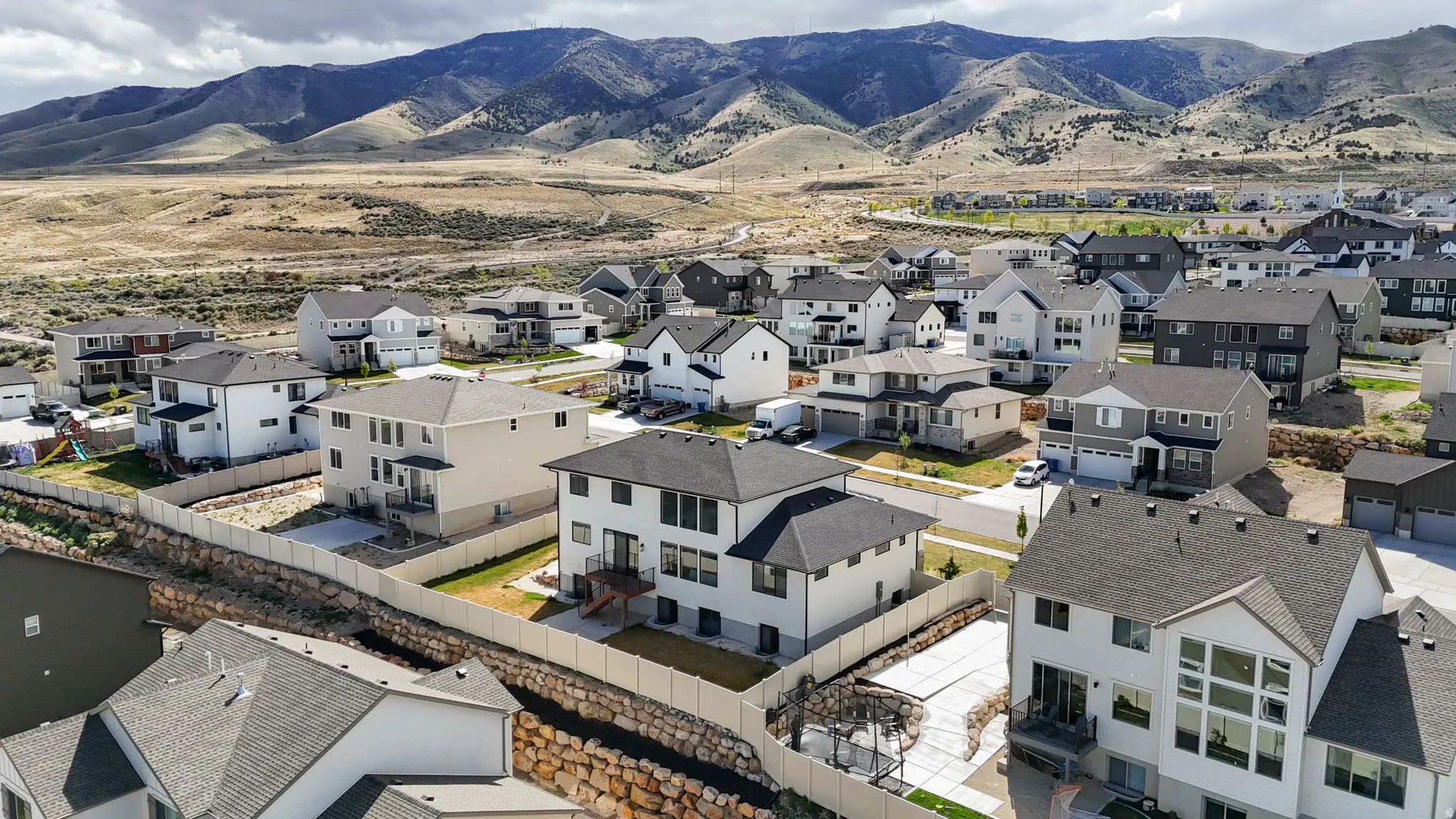 Aerial view of residential area with mountains