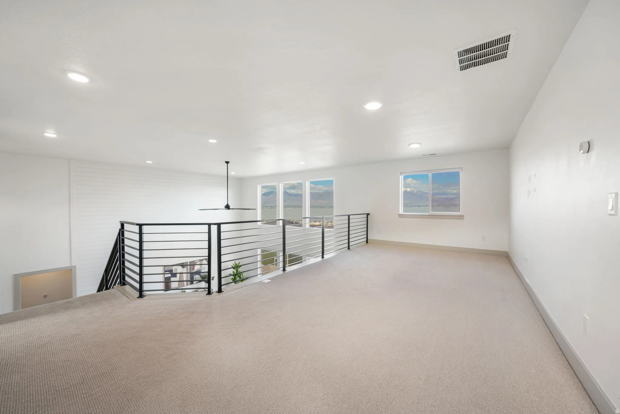 Spare room with carpet flooring and recessed lighting