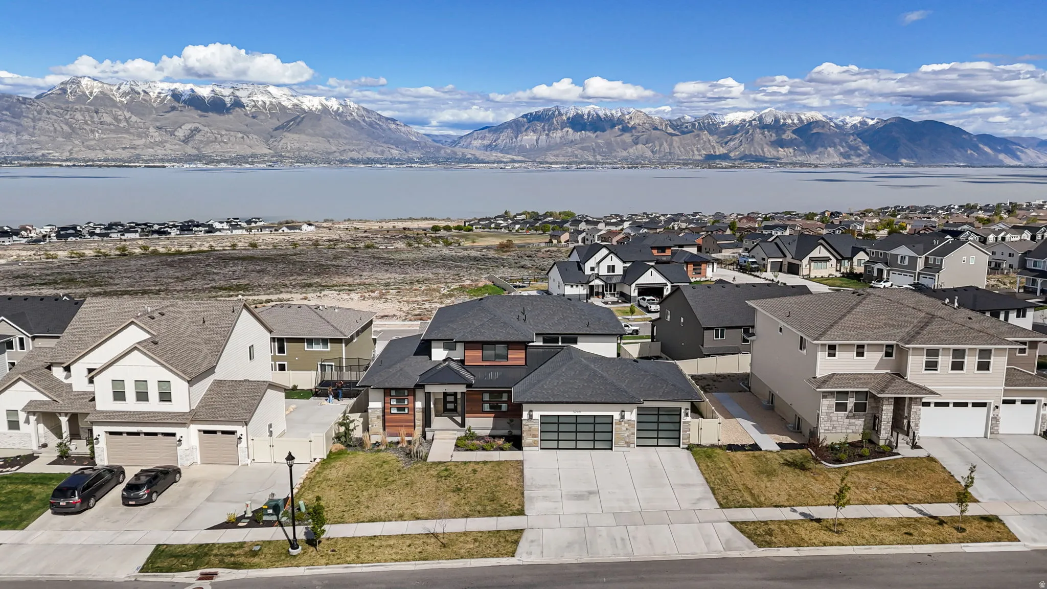 Aerial view of residential area with a water and mountain view