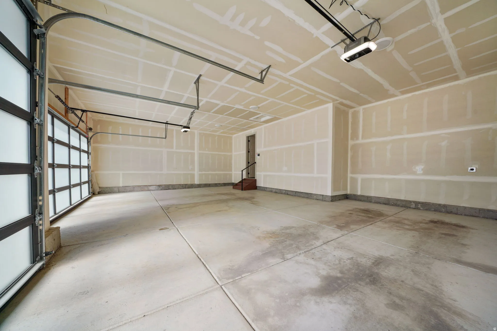 3 Car Oversized Garage featuring garage door openers