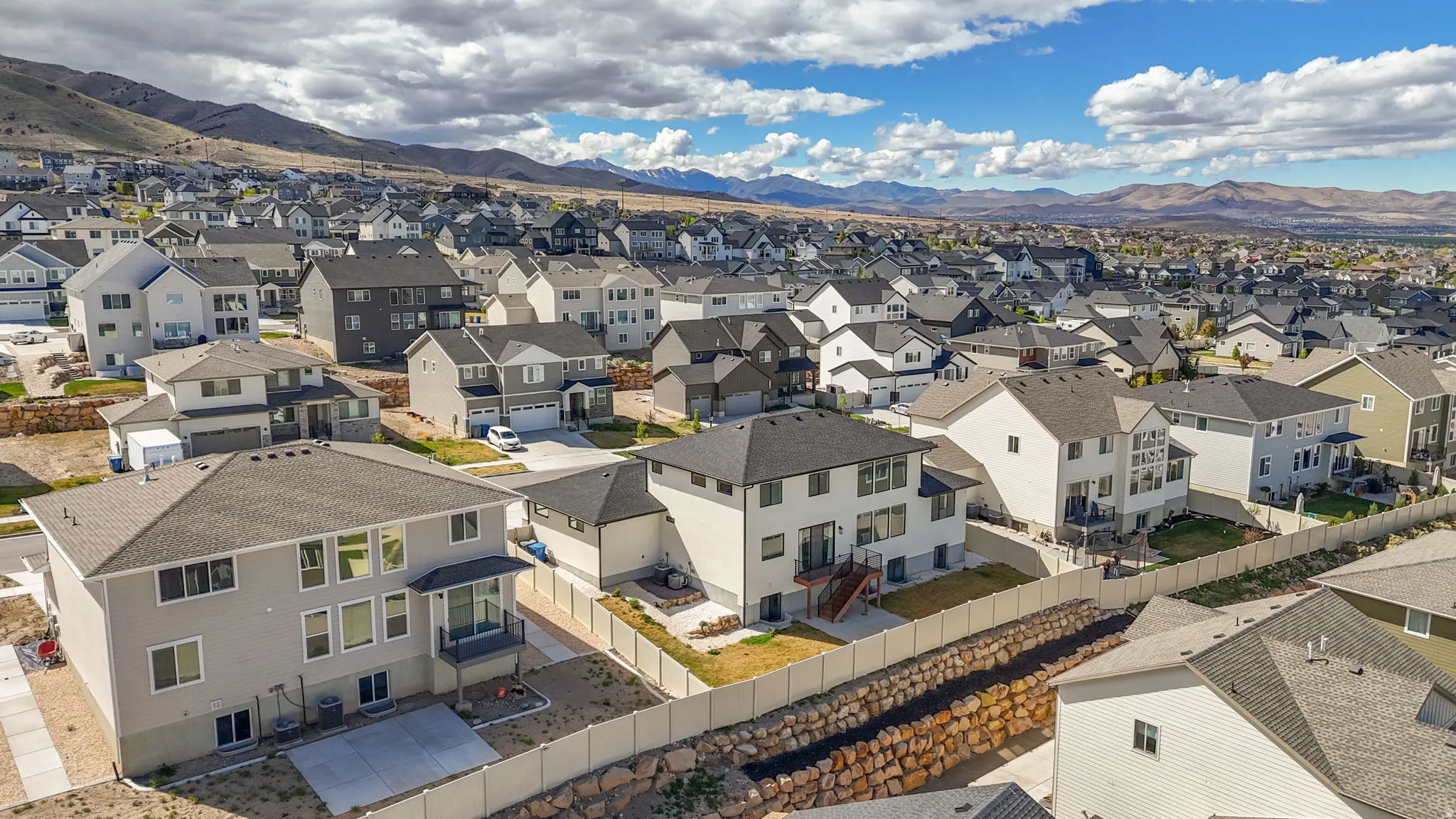 Aerial view of residential area with a mountainous background