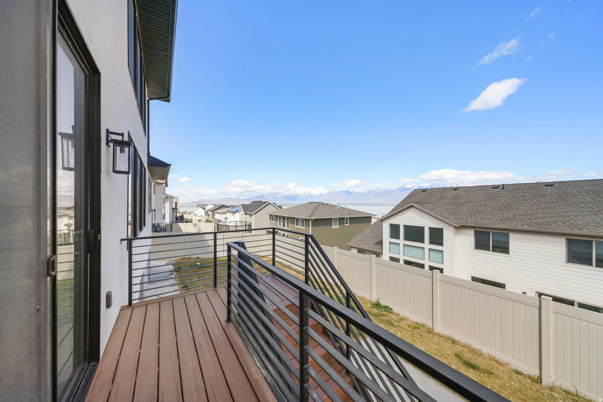 Back Deck featuring lake and mountain views