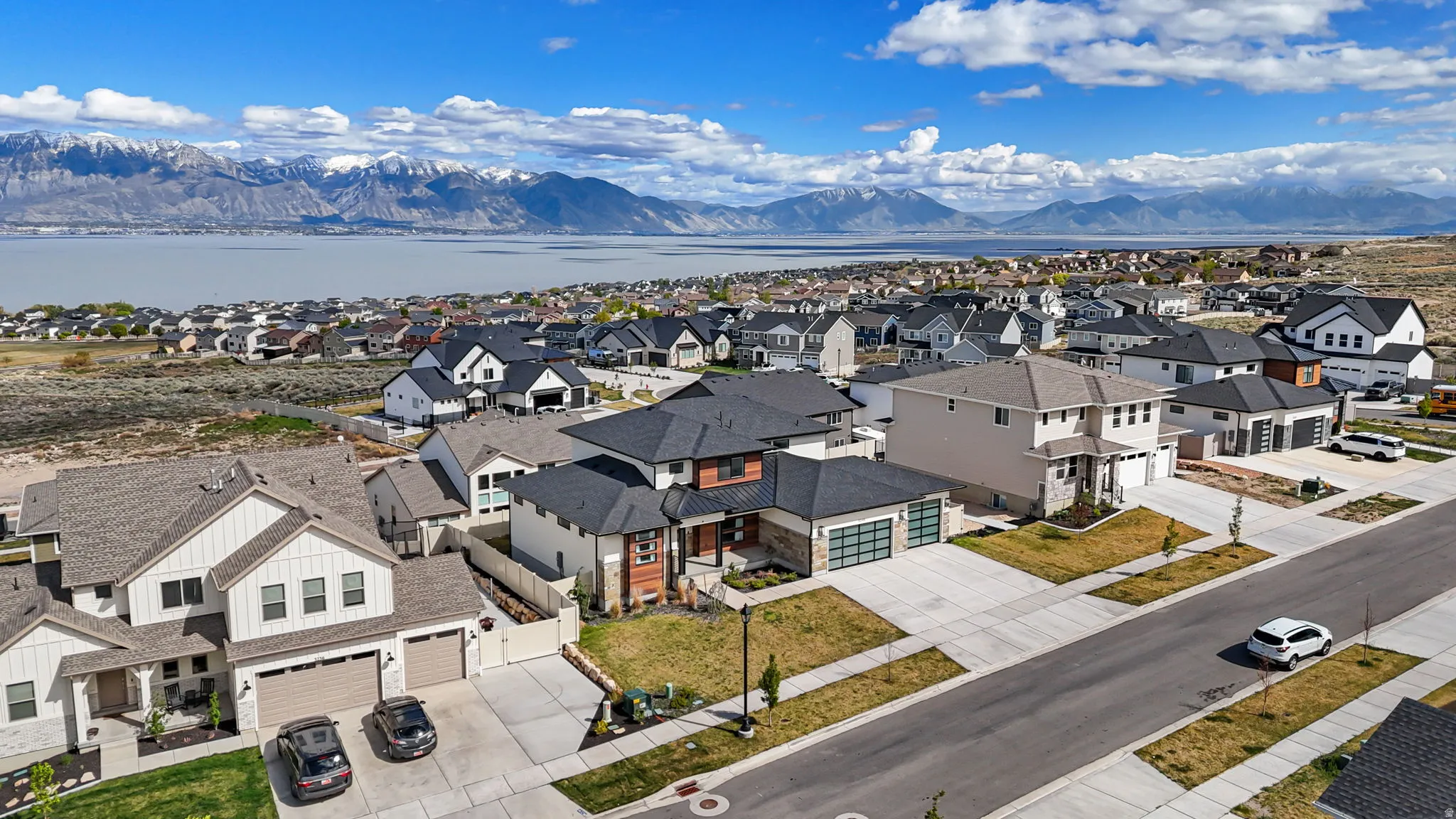 Aerial view of residential area featuring a mountain backdrop