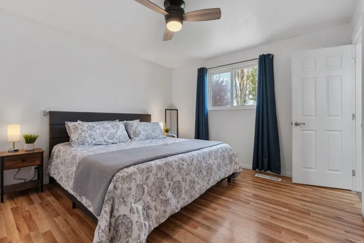 Bedroom featuring light wood-type flooring and ceiling fan