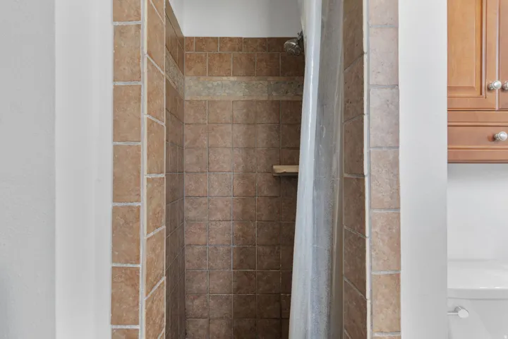Bathroom view of a stall shower