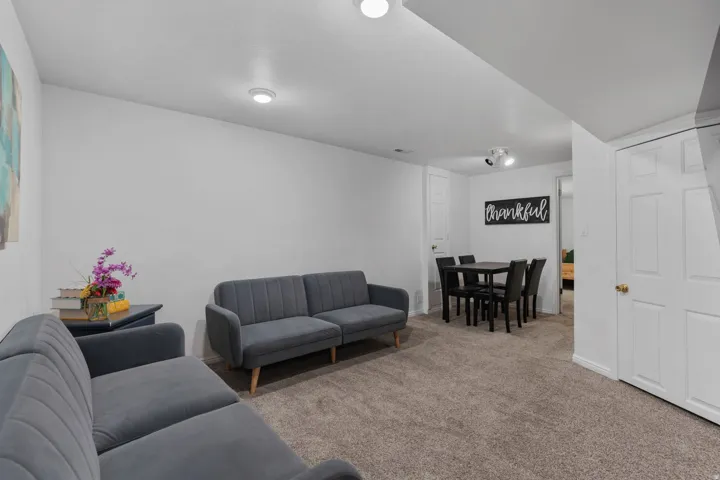 Living area with carpet floors and baseboards
