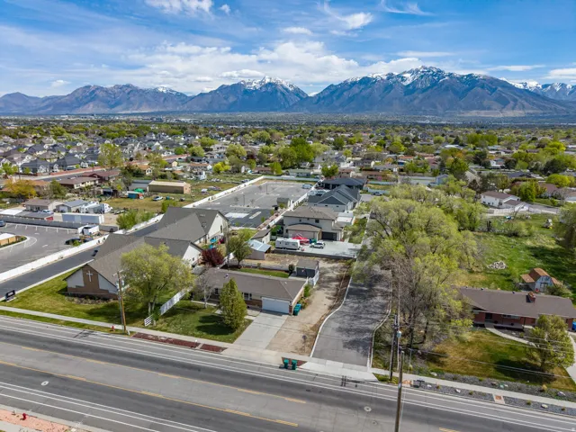Aerial view of residential area featuring a mountainous background