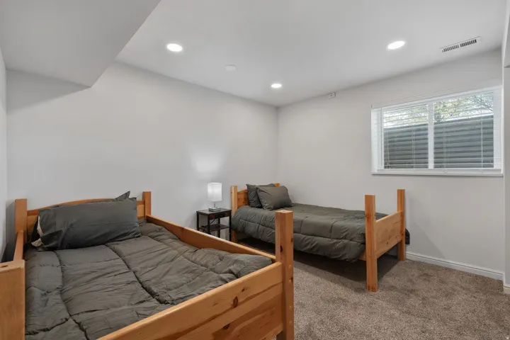 Bedroom featuring carpet and recessed lighting