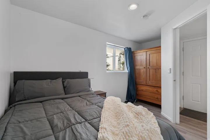 Bedroom featuring light wood finished floors and baseboards