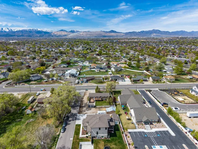 Aerial view of residential area featuring a mountainous background