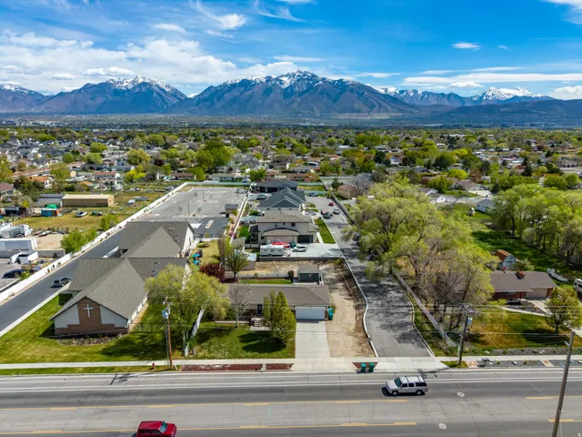 Aerial perspective of suburban area with a mountain backdrop