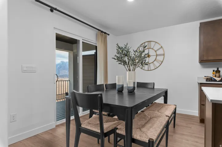 Dining space featuring light wood-type flooring and a mountain view