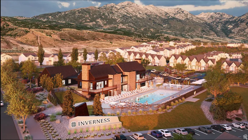 Aerial perspective of suburban area with mountains and a pool area
