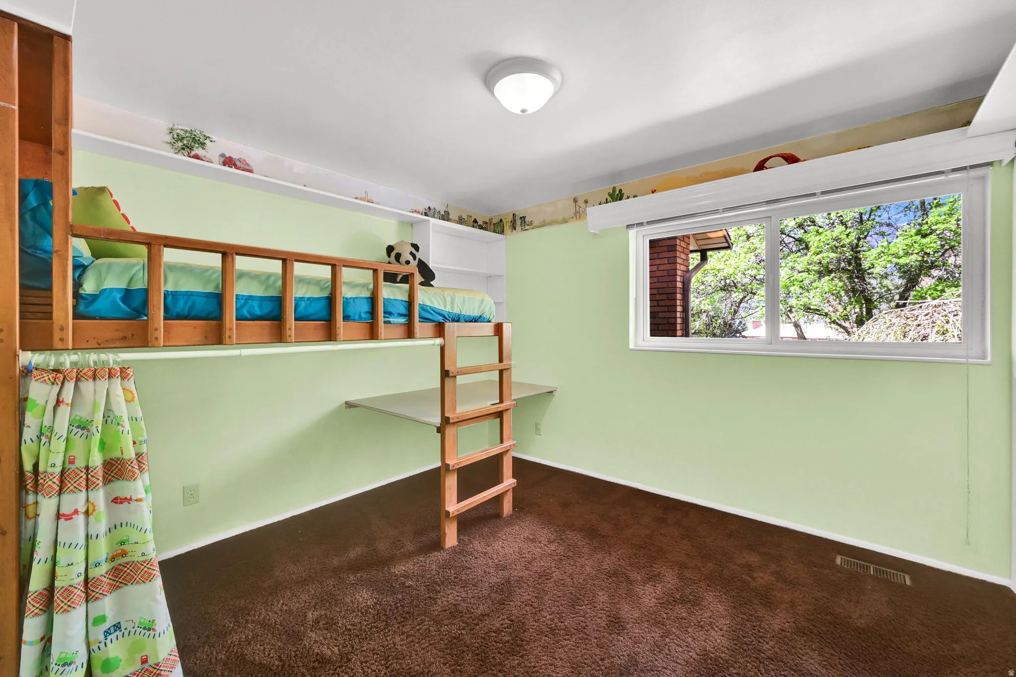 Unfurnished bedroom with dark carpet