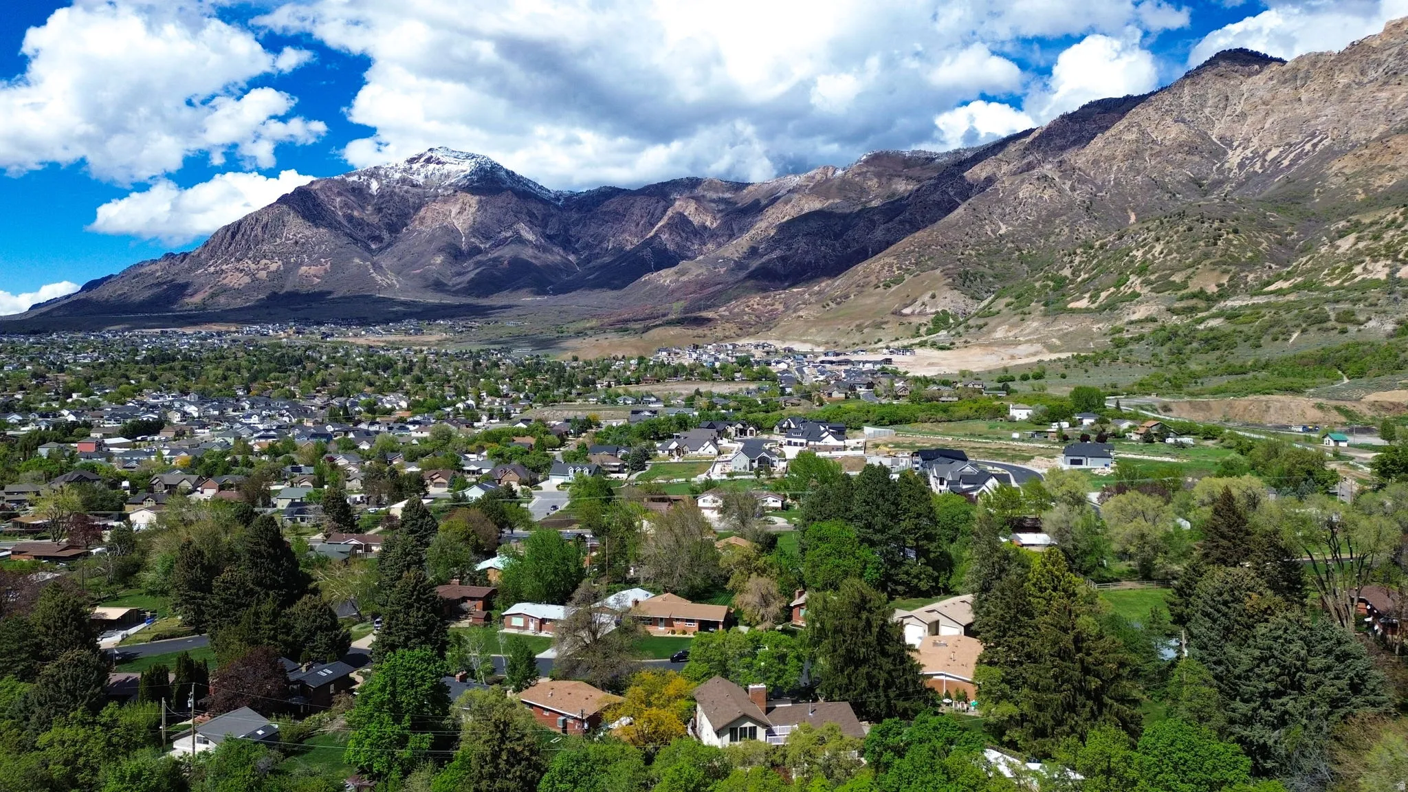 Mountain view featuring nearby suburban area