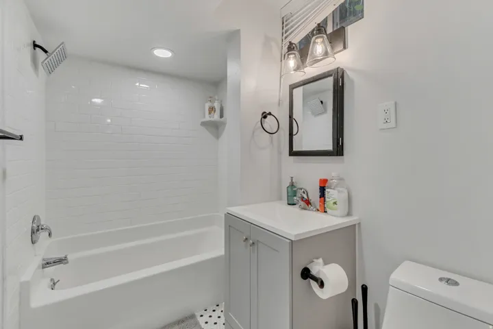 Full bathroom featuring vanity, bathing tub / shower combination, and recessed lighting
