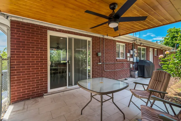 View of patio / terrace with ceiling fan and area for grilling