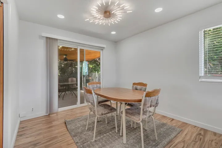 Dining room featuring light wood-style flooring and recessed lighting