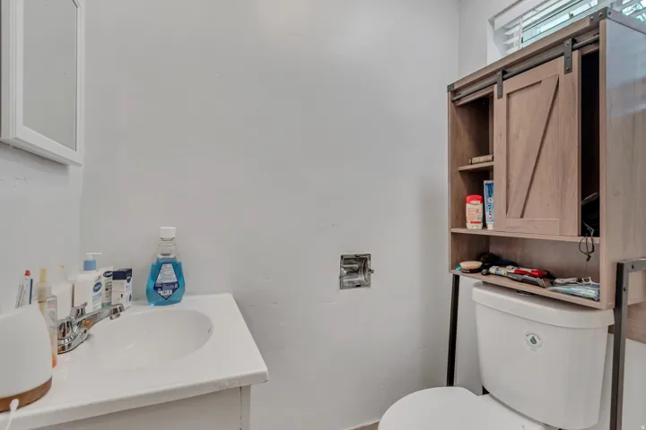 Half bath featuring vanity and toilet