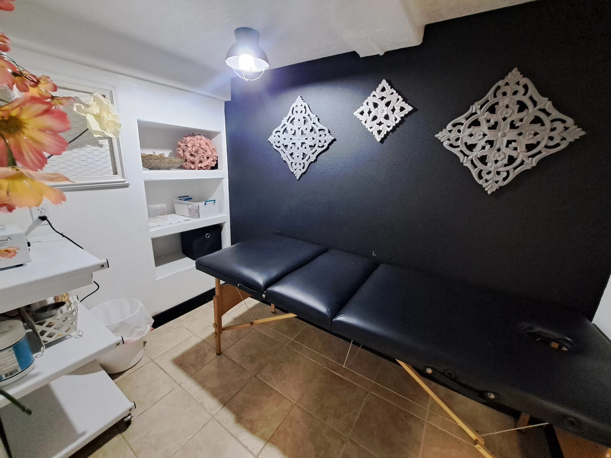 Room with light tile patterned flooring