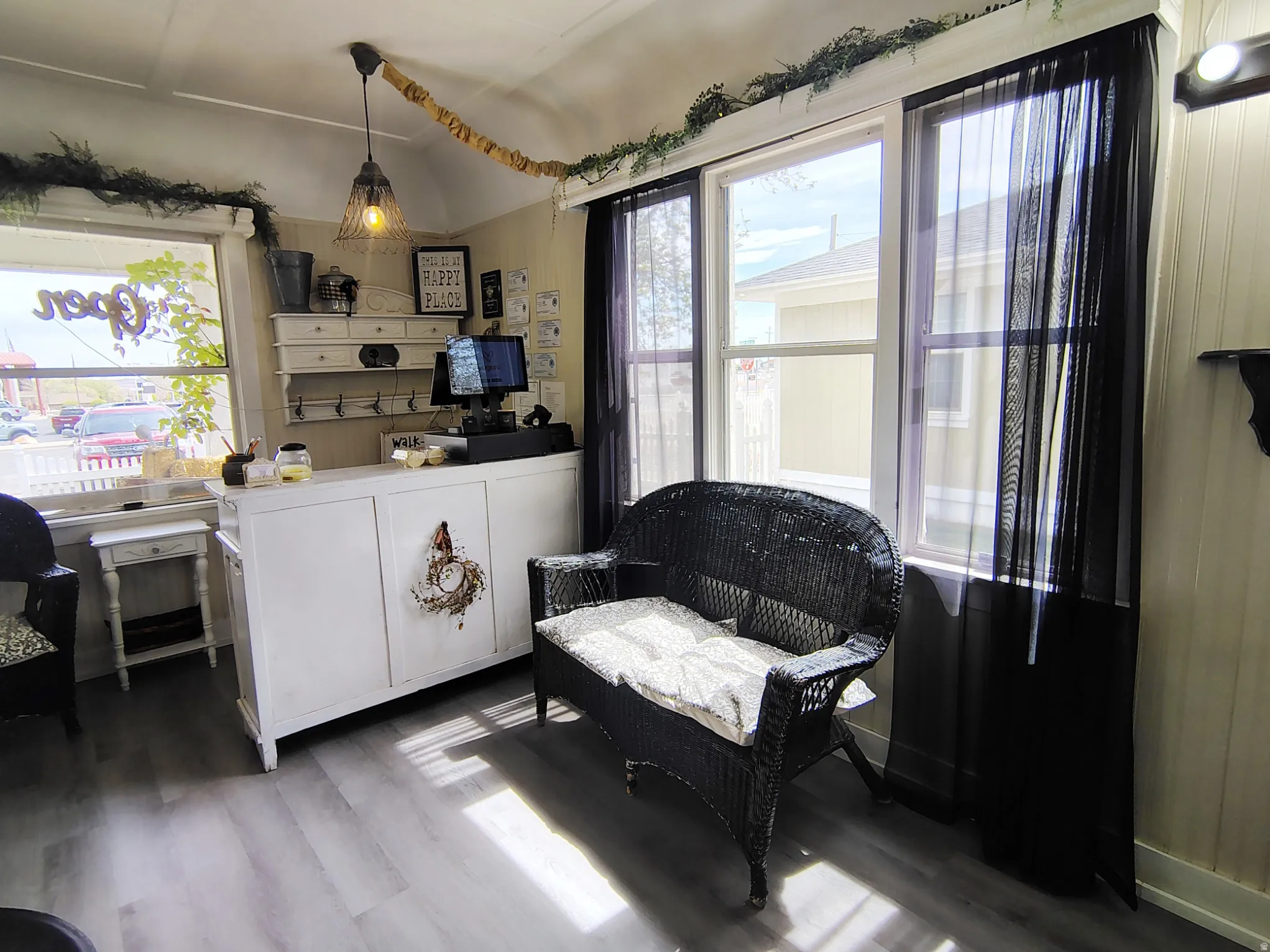 Room featuring light wood finished floors and lofted ceiling