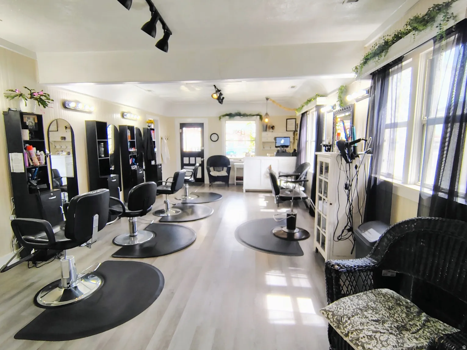 Great Room with light LVP flooring and arched walkways