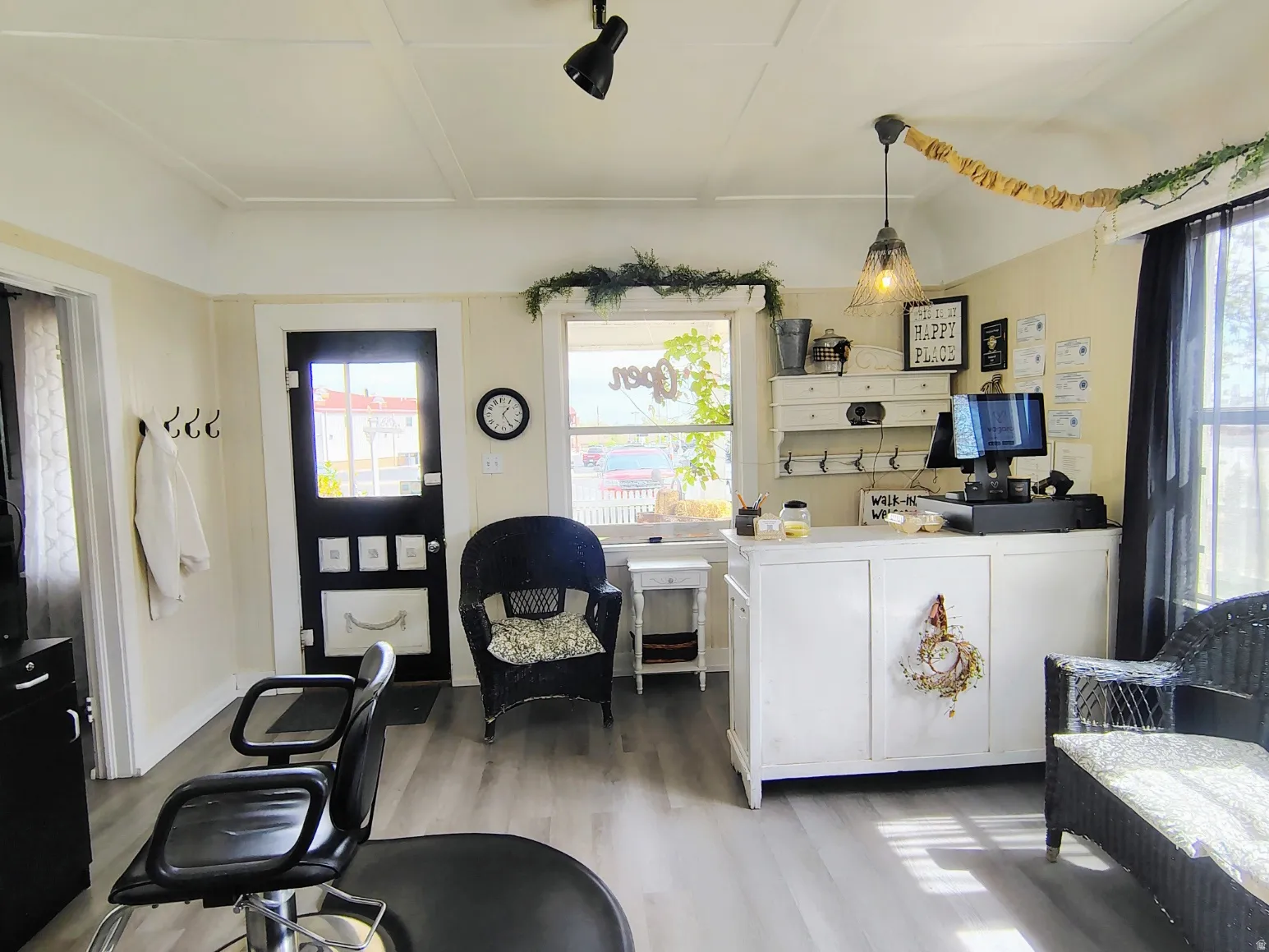 Great Room with light LVP flooring and arched walkways