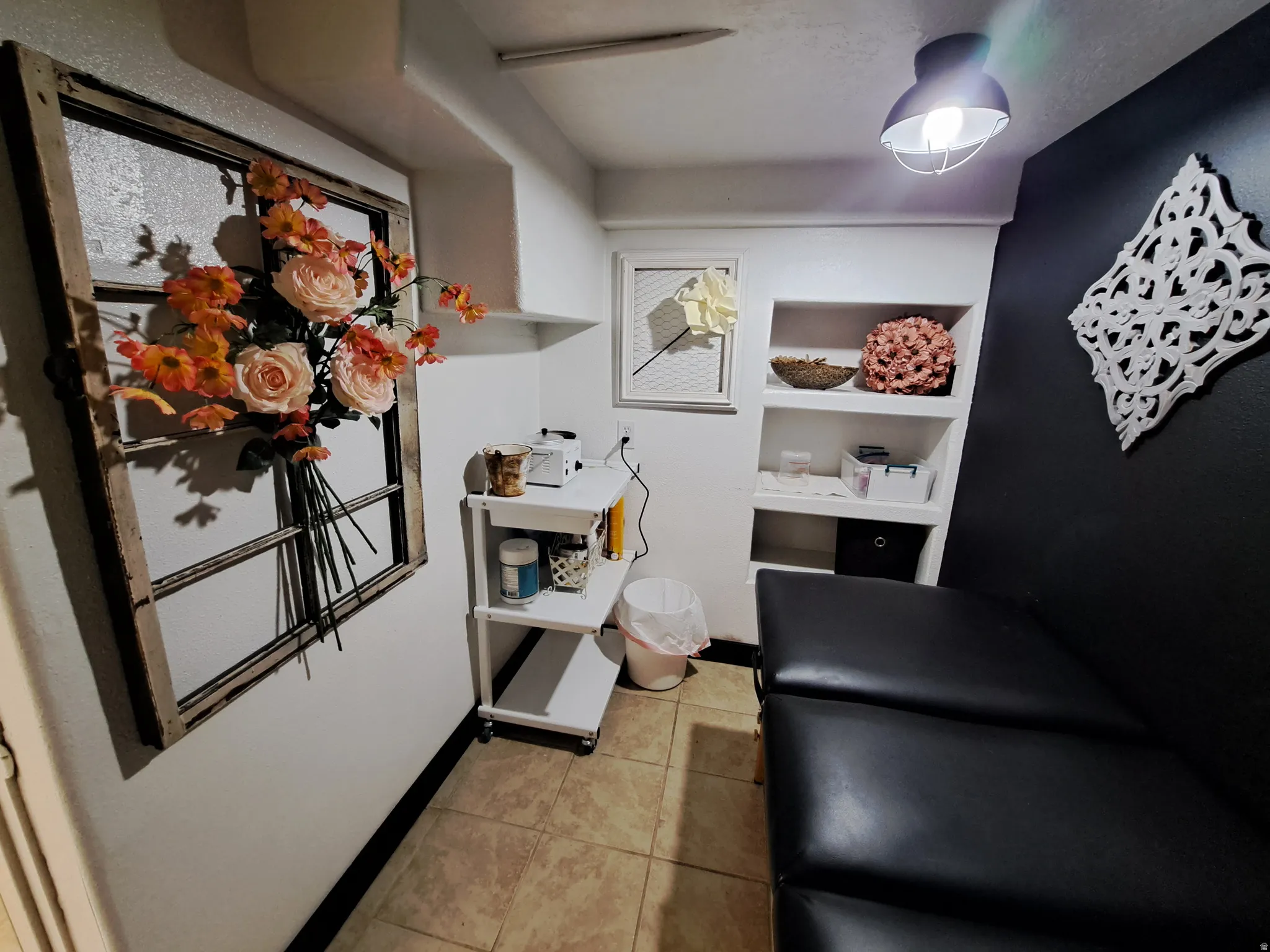 Mudroom with light tile patterned floors and baseboards
