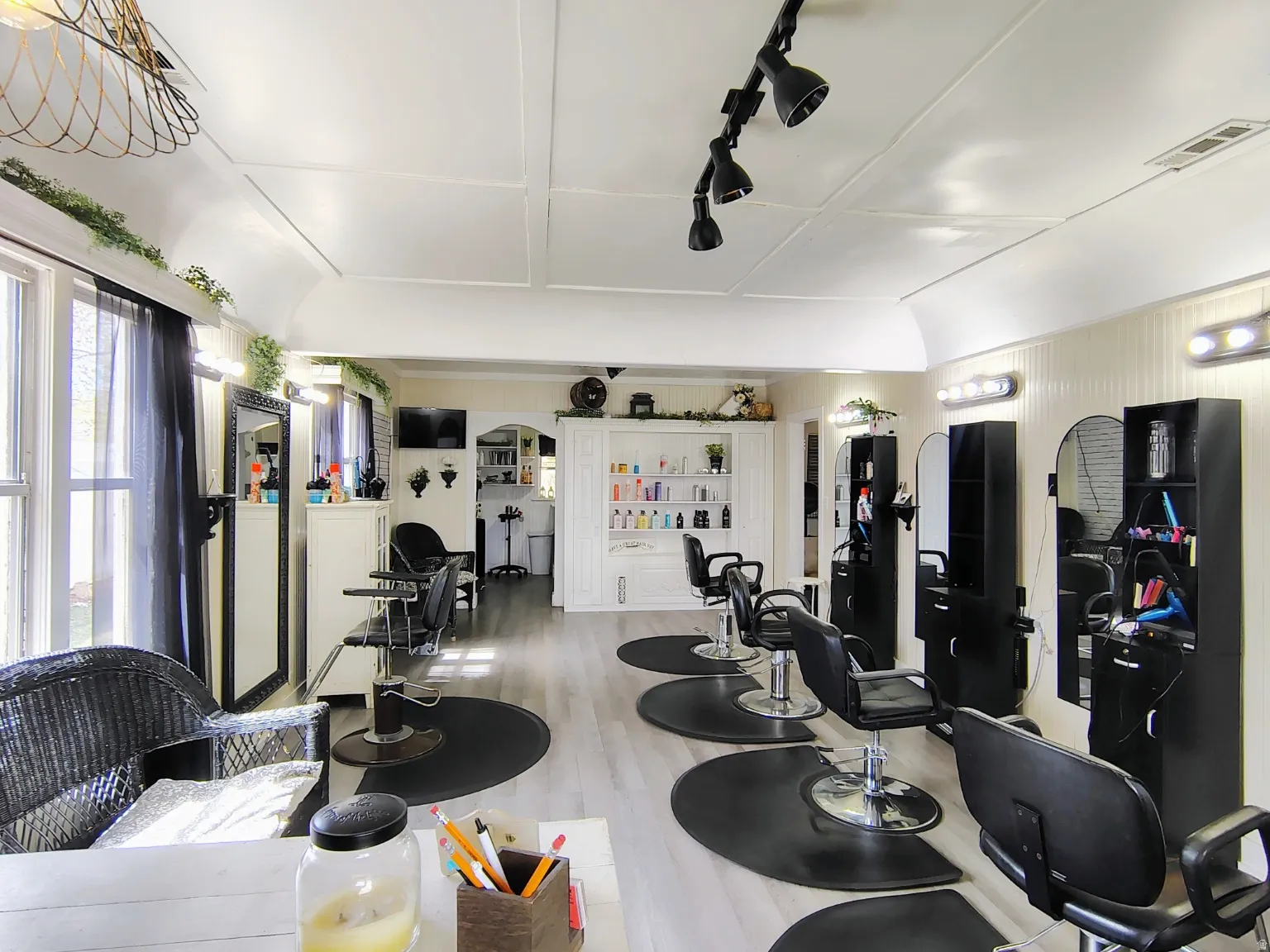 Great Room with light LVP flooring and arched walkways