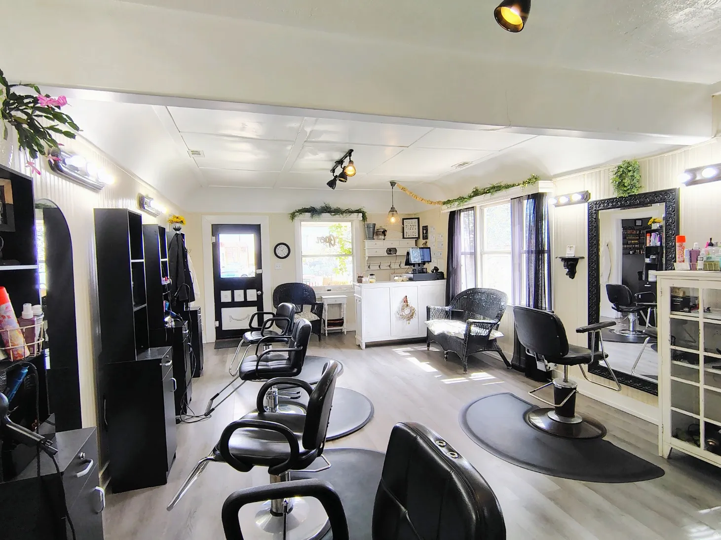 Great Room with light LVP flooring and arched walkways