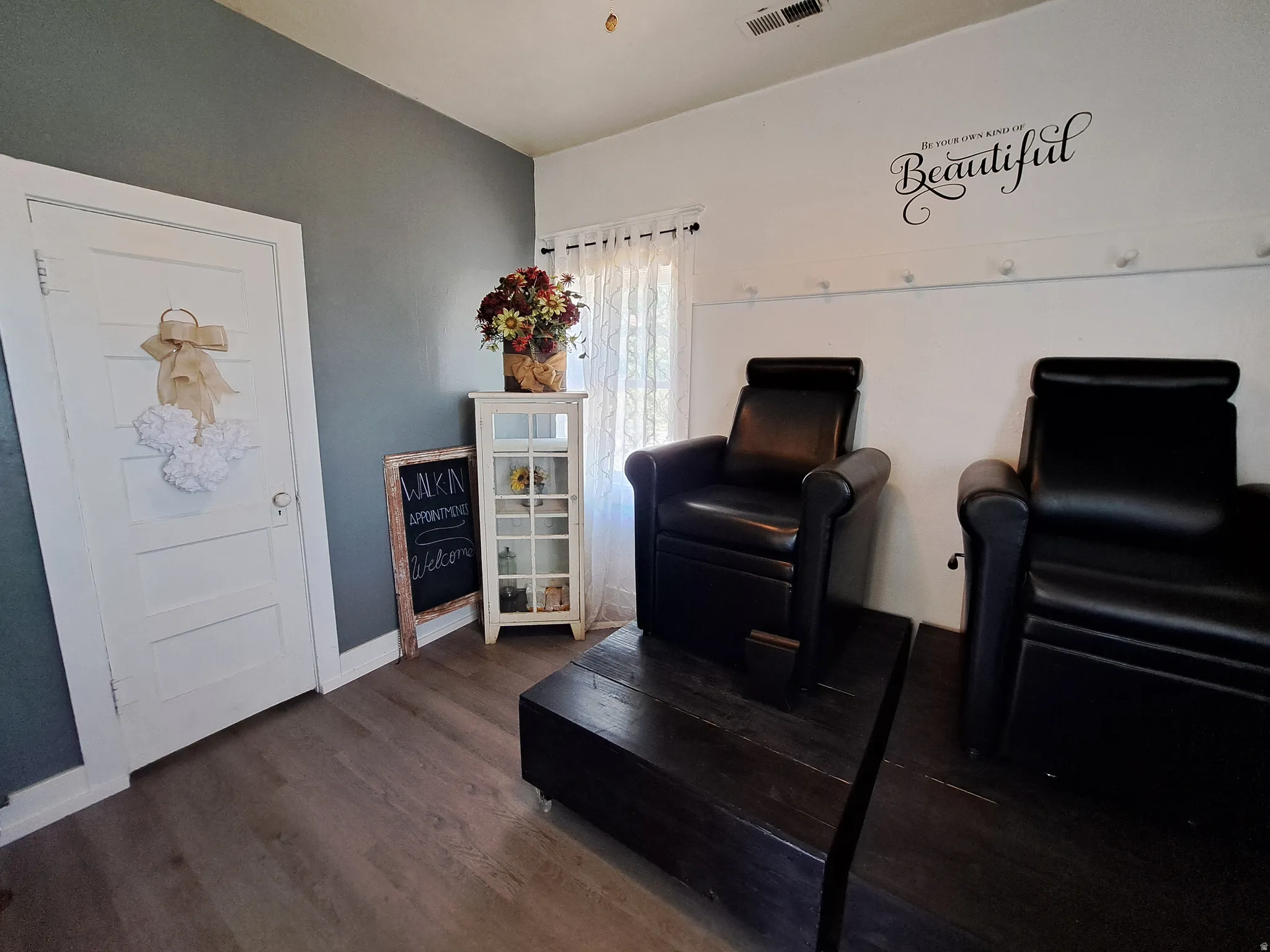 Room featuring dark wood-style floors and baseboards