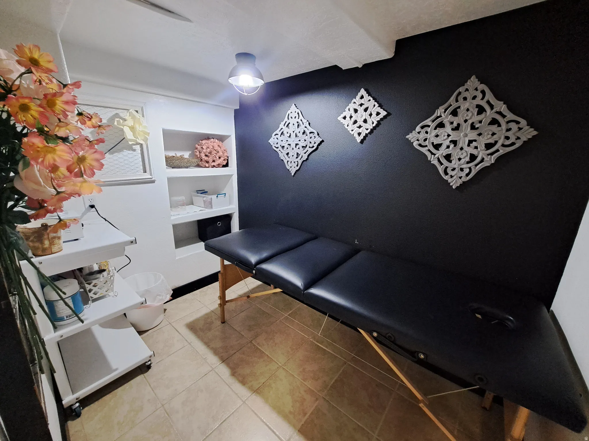 Area featuring light tile patterned floors and built in features