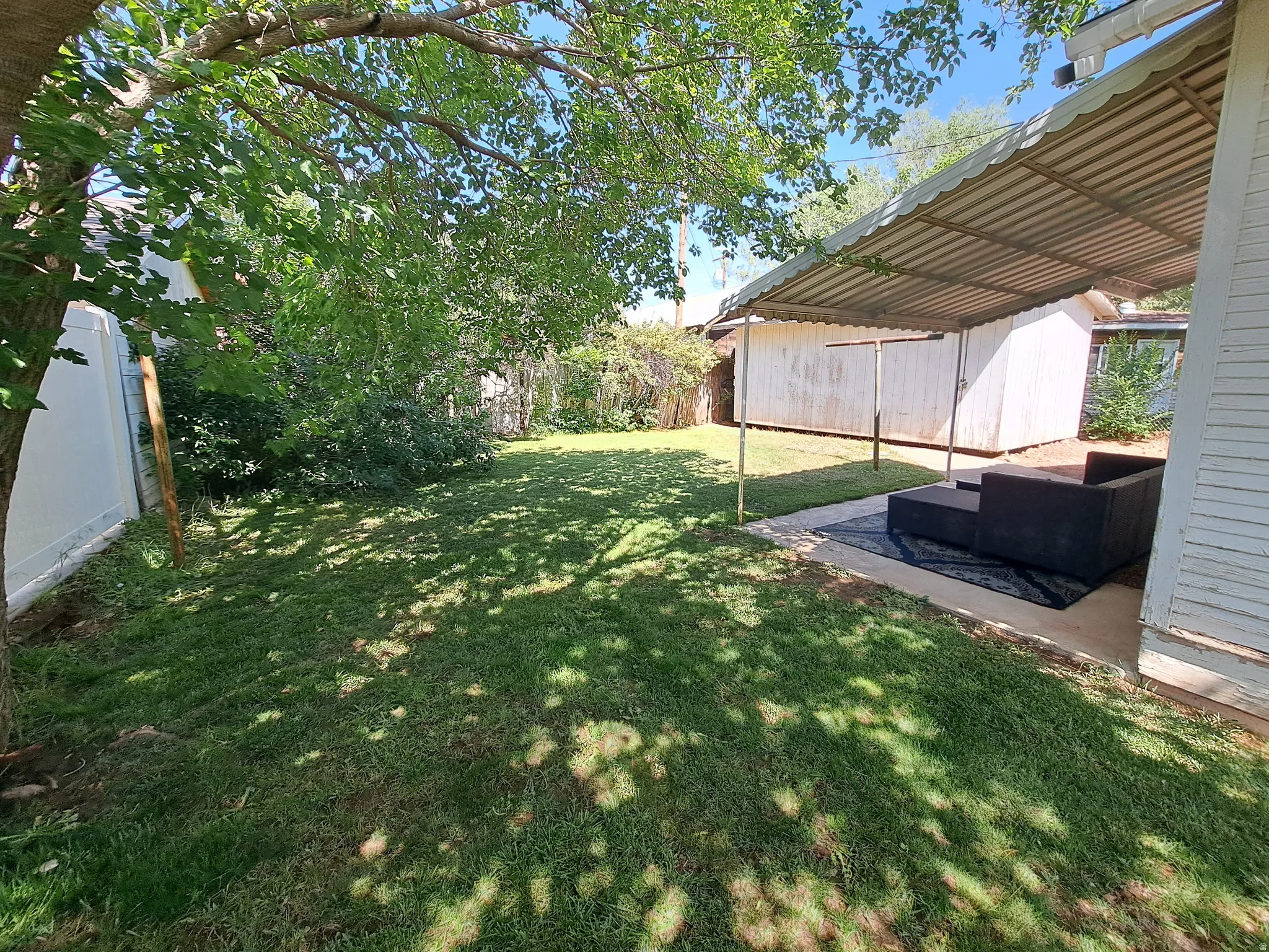 Fenced backyard featuring a patio area
