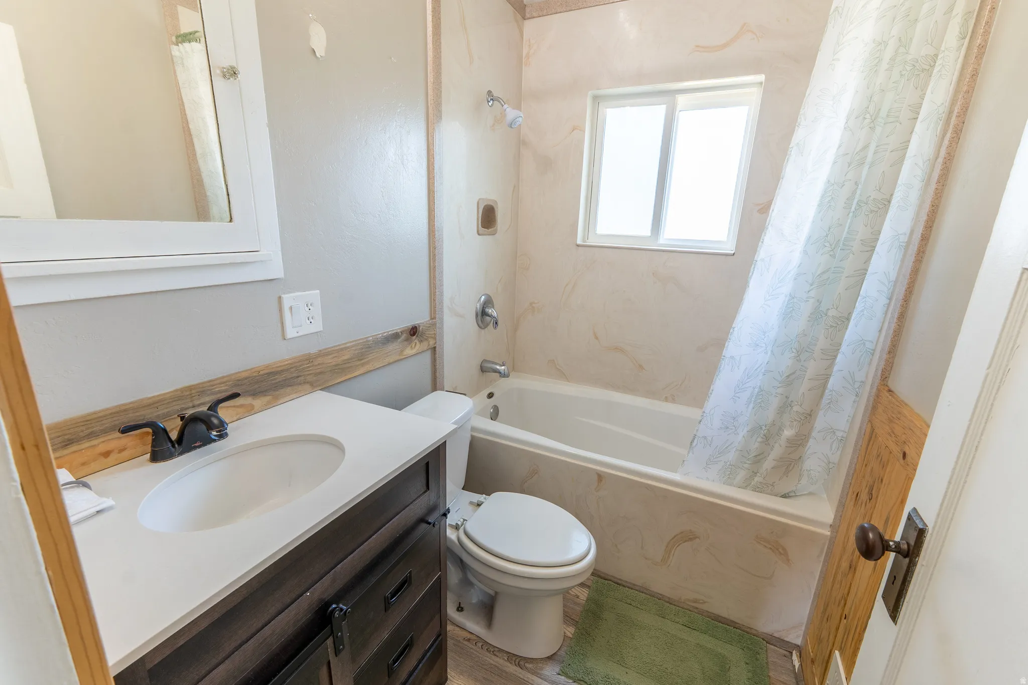 Bathroom with vanity and shower / bath combo