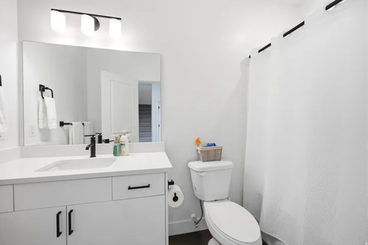 Full bathroom featuring vanity and a shower with shower curtain