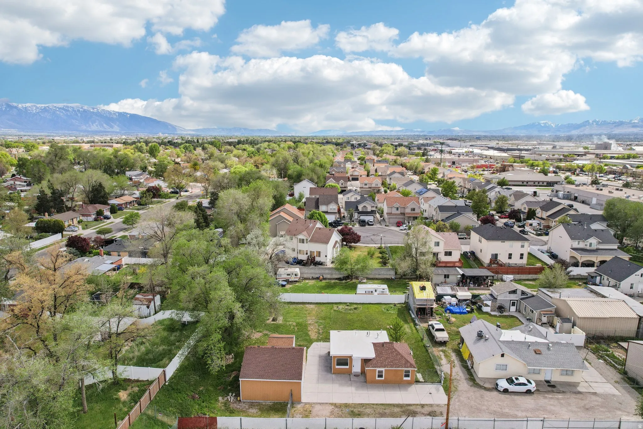 Aerial perspective of suburban area with a mountainous background